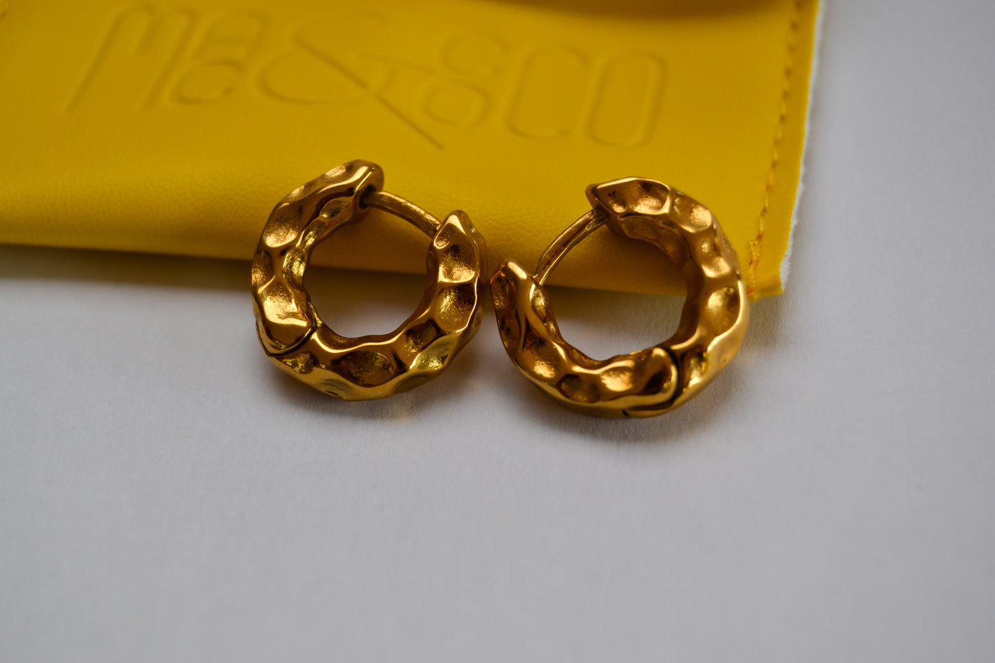 Hammered detail huggie