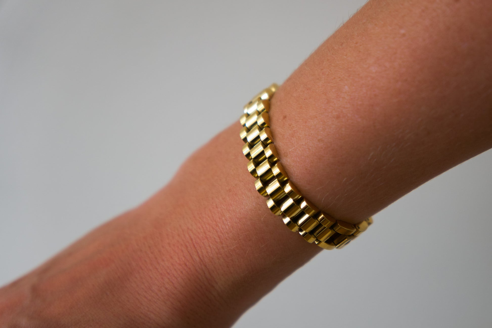 Gold president link bracelet worn on wrist, 18k gold plated stainless steel, Mac&Coco South Africa