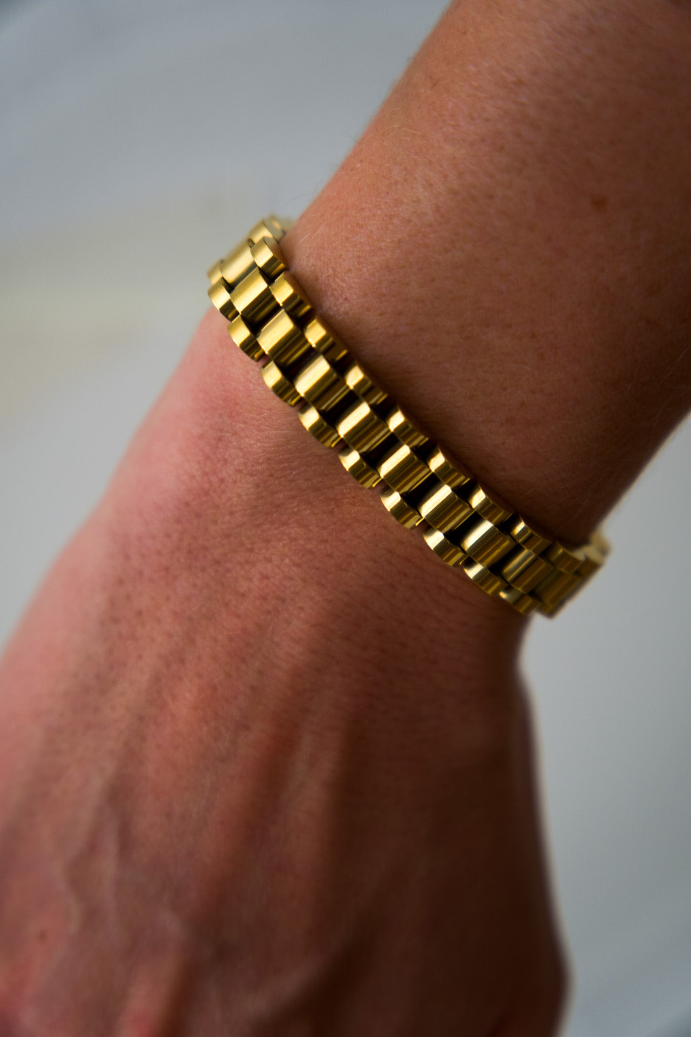 Gold president link bracelet worn on wrist, 18k gold plated stainless steel, Mac&Coco South Africa