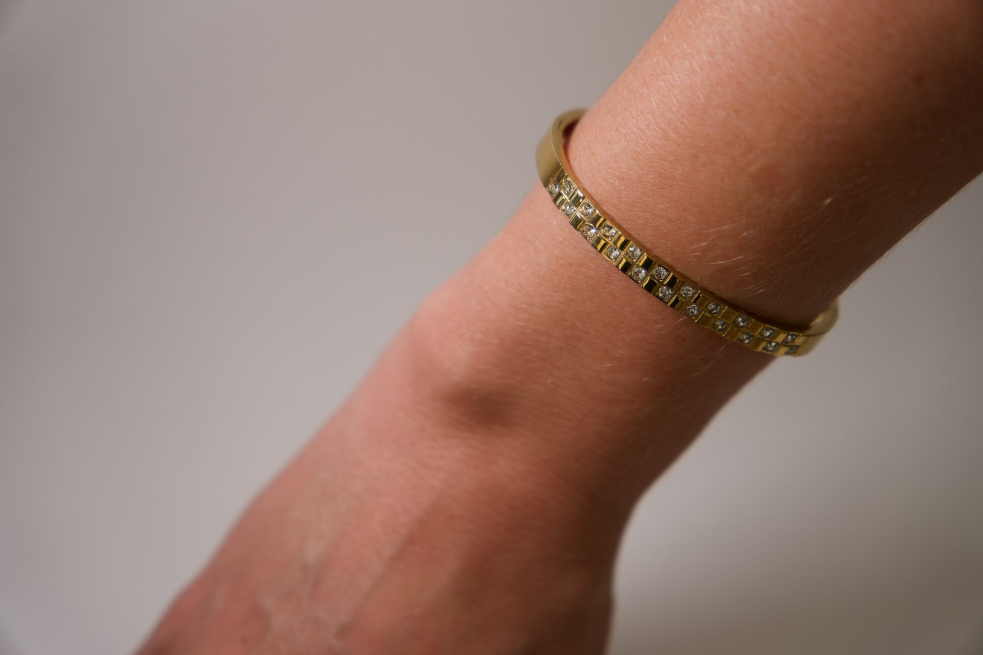 Gold crystal grid bangle bracelet with pavé stone detailing, 18k gold plated stainless steel, Mac&Coco South Africa