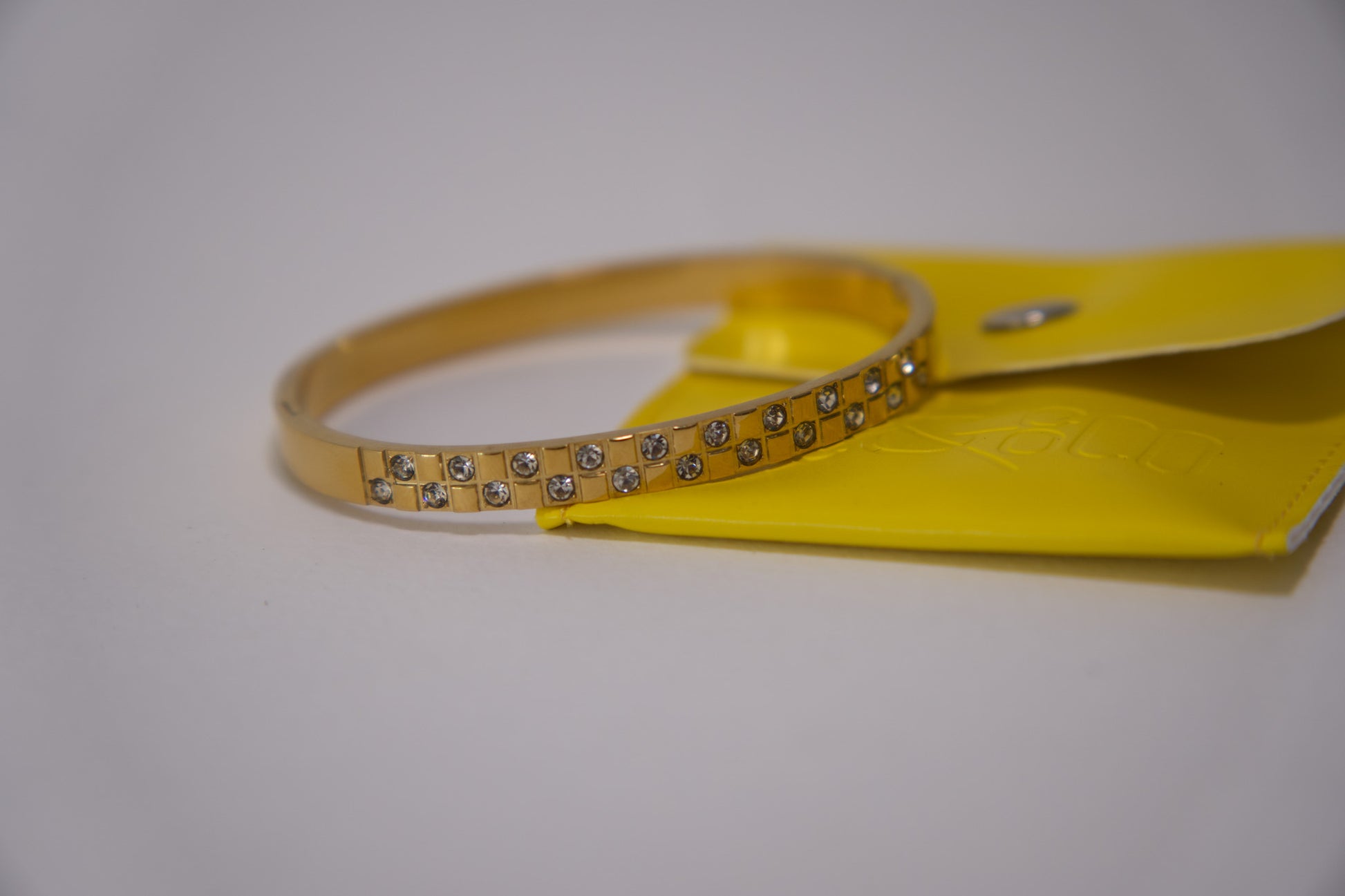 Gold crystal grid bangle bracelet with pavé stone detailing, 18k gold plated stainless steel, Mac&Coco South Africa