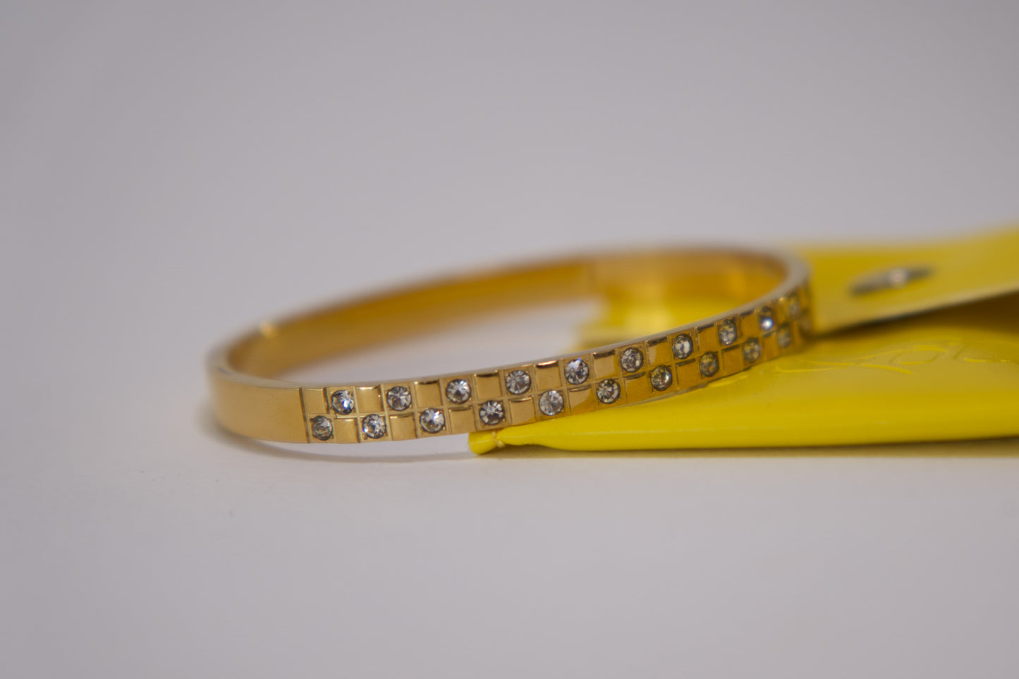 Gold crystal grid bangle bracelet with pavé stone detailing, 18k gold plated stainless steel, Mac&Coco South Africa
