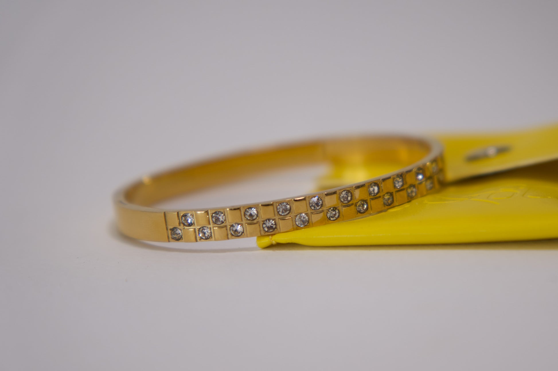 Gold crystal grid bangle bracelet with pavé stone detailing, 18k gold plated stainless steel, Mac&Coco South Africa