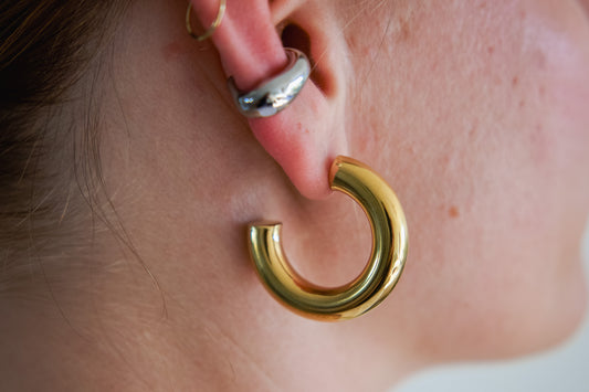 Chunky gold tube hoop earring worn on ear, 18k gold plated stainless steel, Mac&Coco South Africa