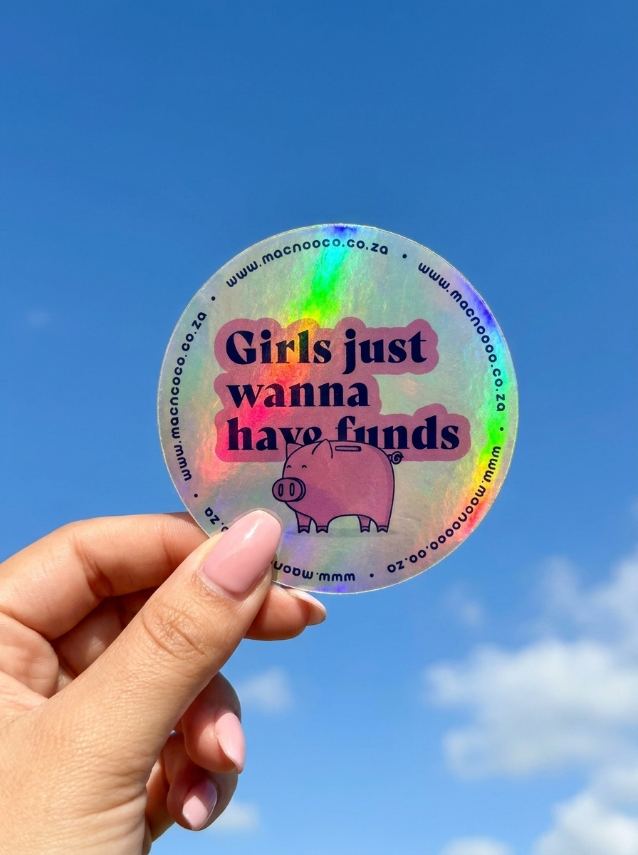 Holographic licence disc sticker held against blue sky